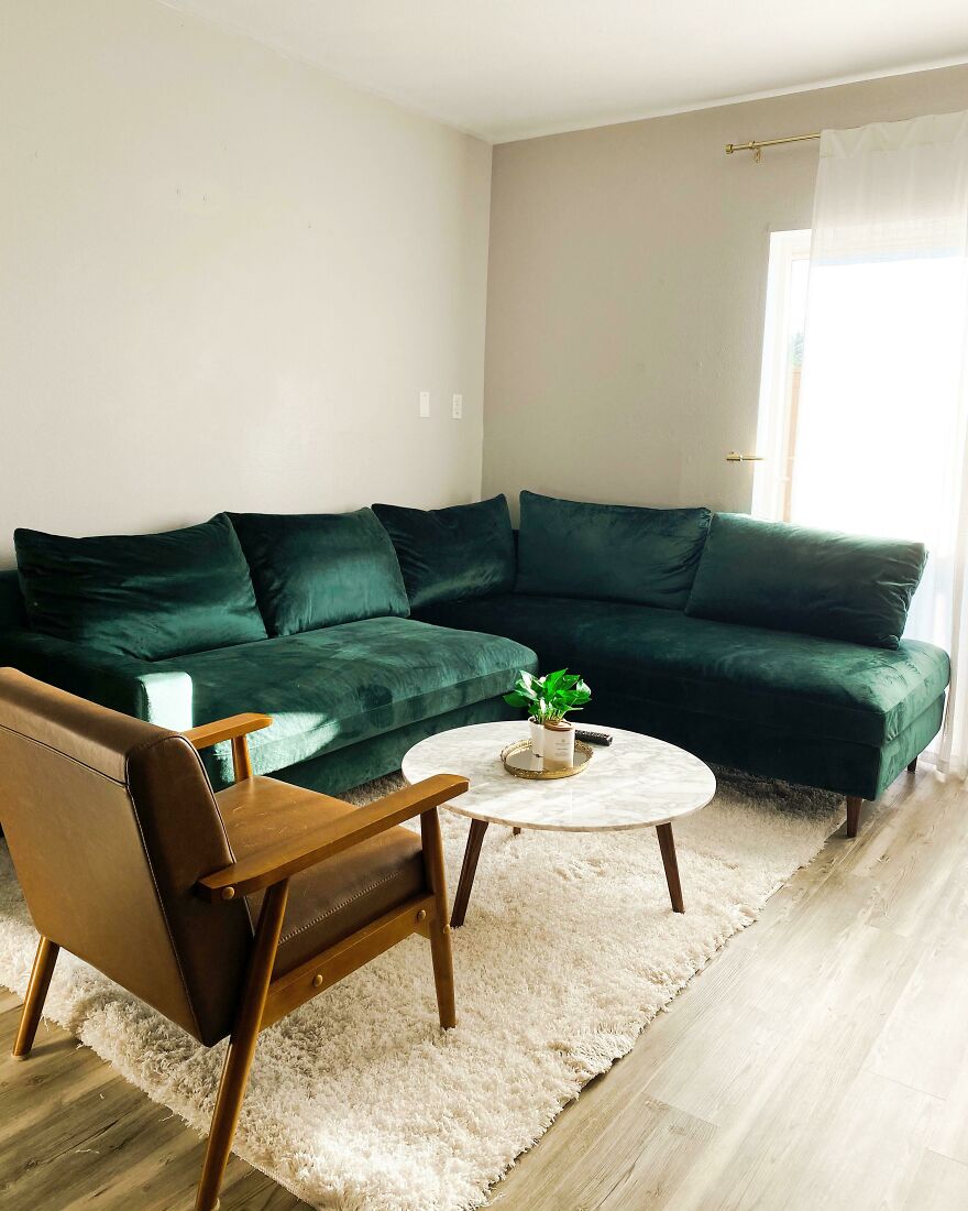 Green couch in the white living room 