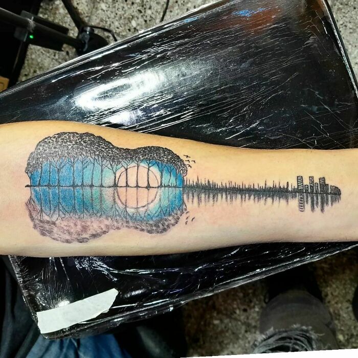 Blue guitar tattoo