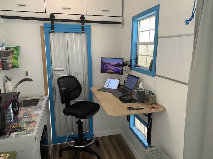 White small room with blue windows 