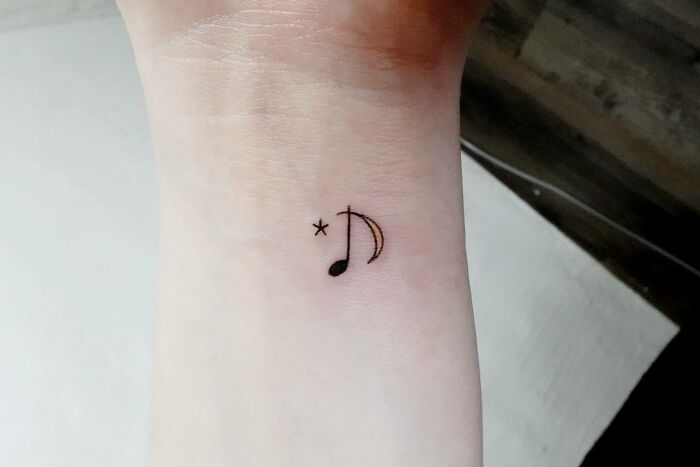 Music note, moon and star tattoo