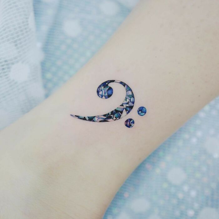 Musical symbol F clef jewelry style tattoo