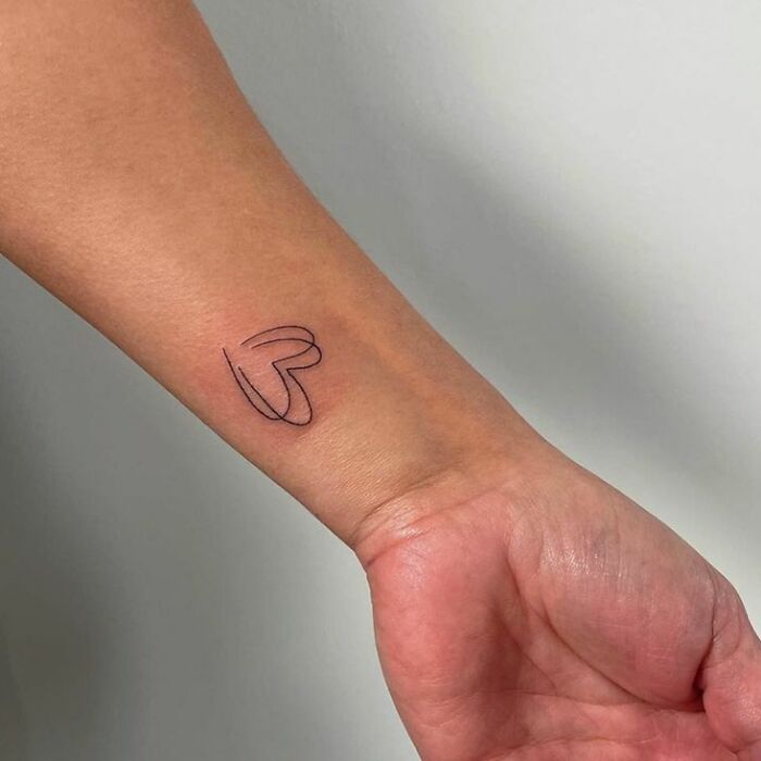 Fineline Hearts tattoo on wrist