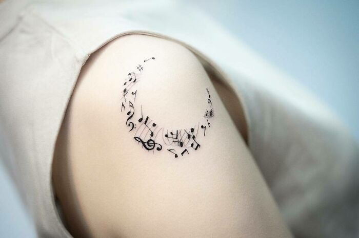 Musical Notes shoulder tattoo