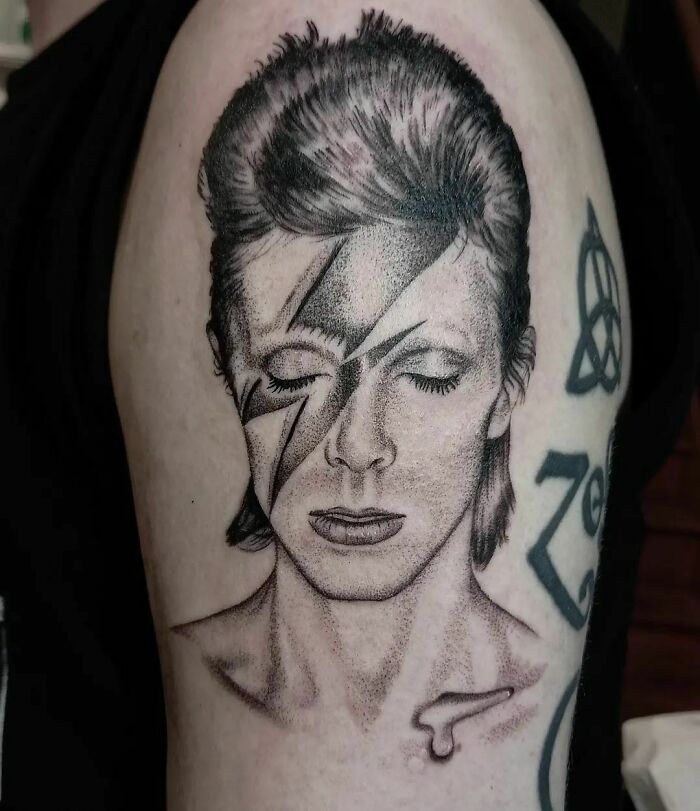Realistic David Bowie portrait eyes closed tattoo
