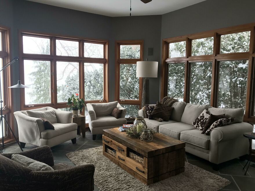 Grey room with light grey couch and chairs 