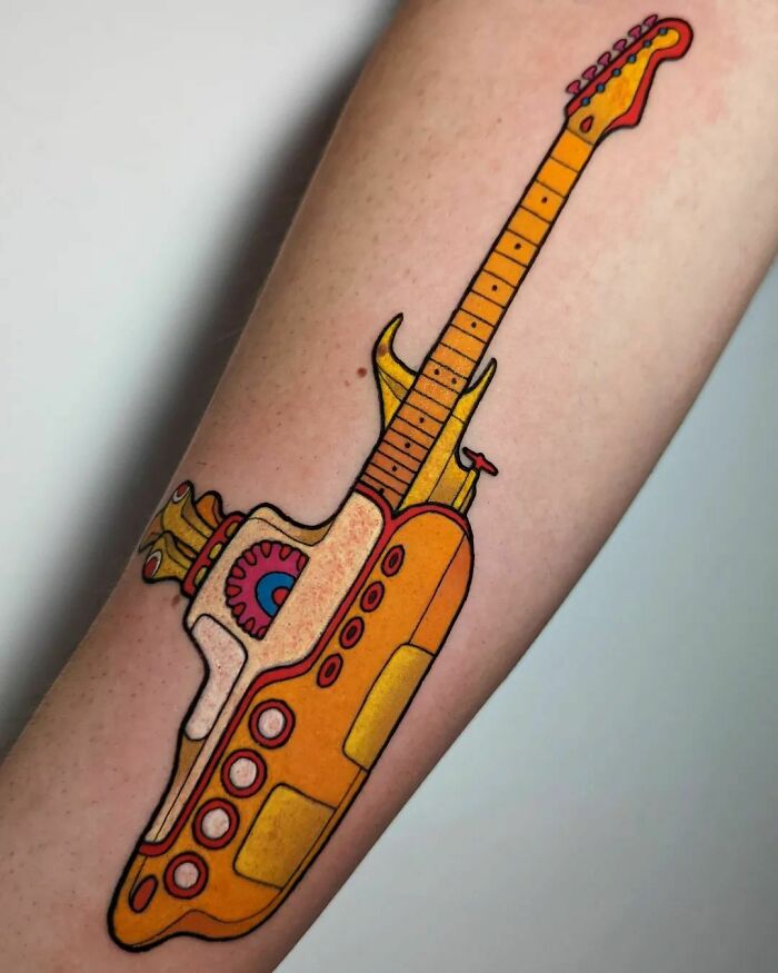 Yellow guitar submarine tattoo