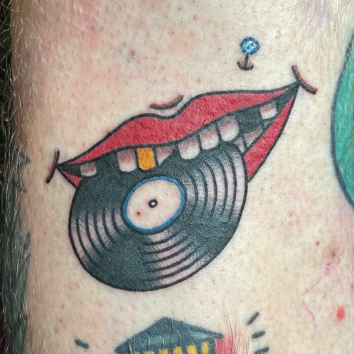 Vinyl in mouth tattoo