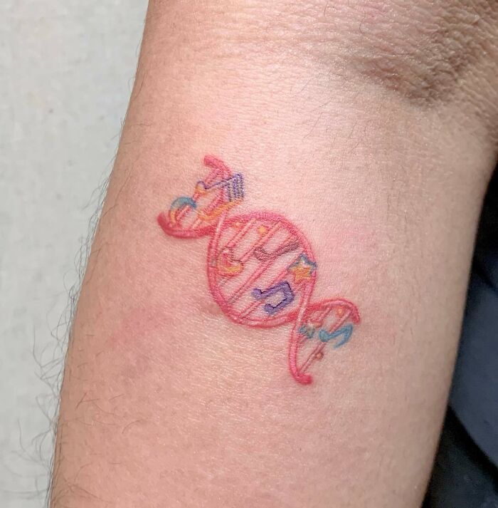 Red DNA and music notes tattoo