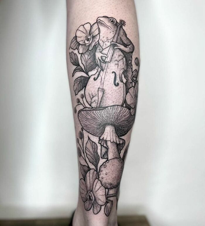 Realistic tattoo with frog sitting on mushroom and playing double bass