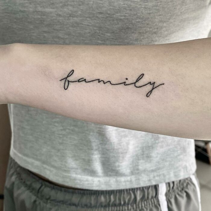 Family word arm tattoo