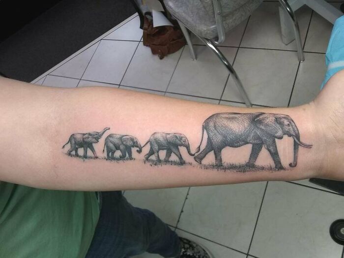 Elephant Family arm tattoo