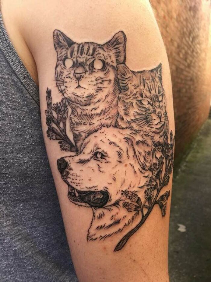 Cats and dog family arm tattoo