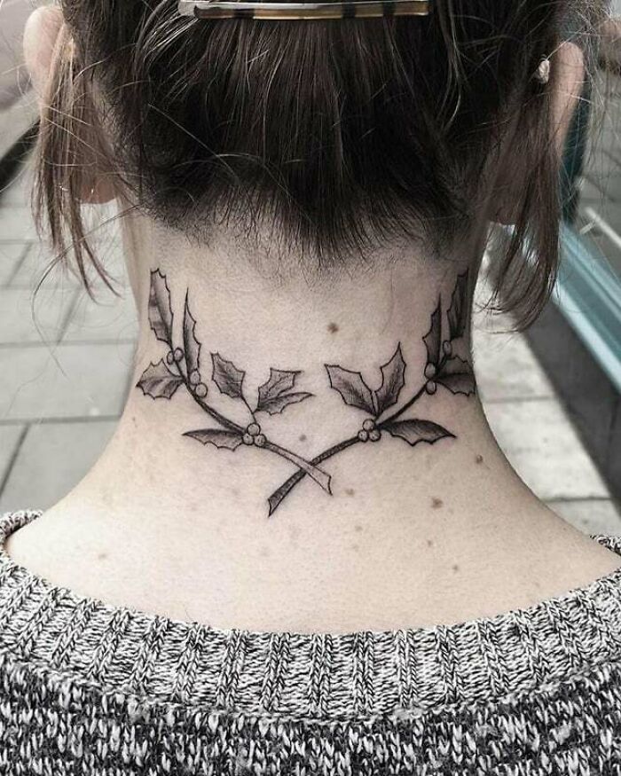 Holly branches family crest back neck tattoo