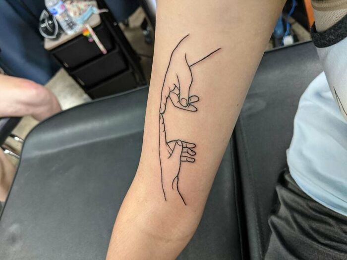 The creation of Adam arm tattoo