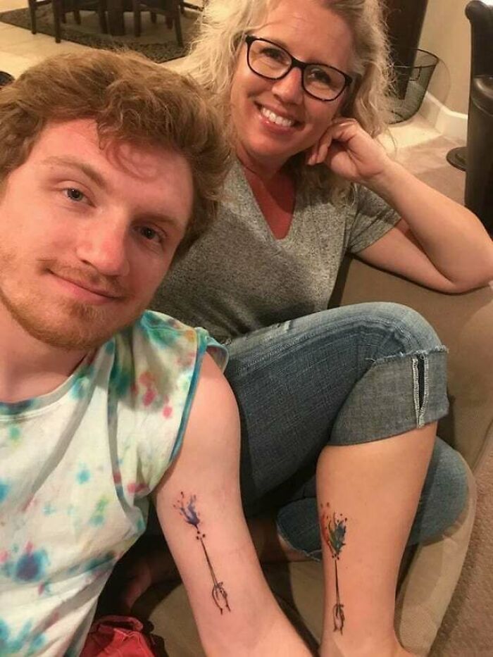 Matching mother and son arm tattoo
