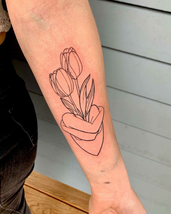 family line flowers arm tattoo