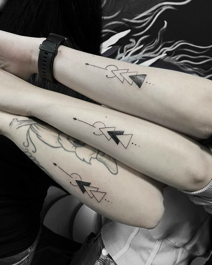 matching geometrical family arm tattoos