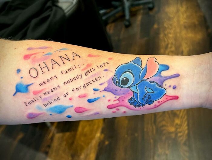 colorful ohana and stitch arm tattoo
