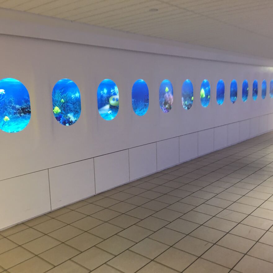 My Local Airport Added A New Display To Mimic The Inside Of A Plane. They Chose An Underwater Scene As The Background. How Reassuring