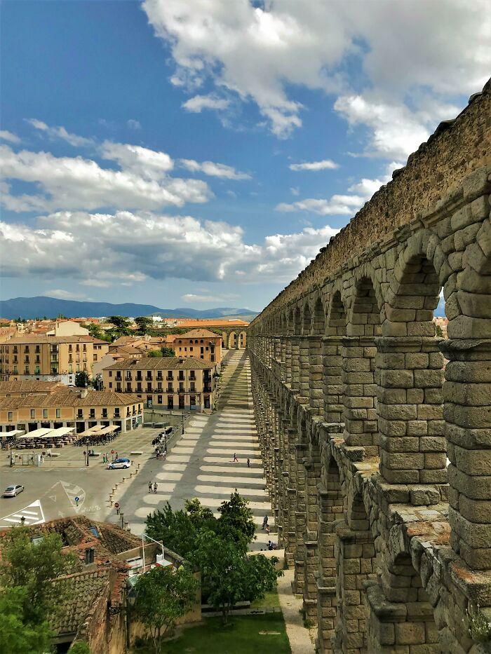 Roman Aqueduct Overshadowing The Old Town Of Segovia, Spain