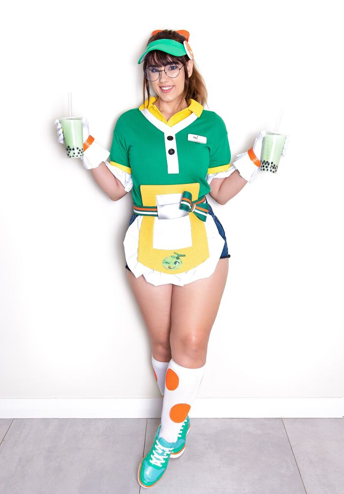 Person cosplaying Honeydew Mei from Overwatch