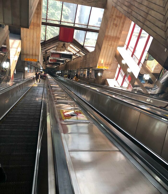 Very Long Escalator At The Subway Station In Chongqing, China