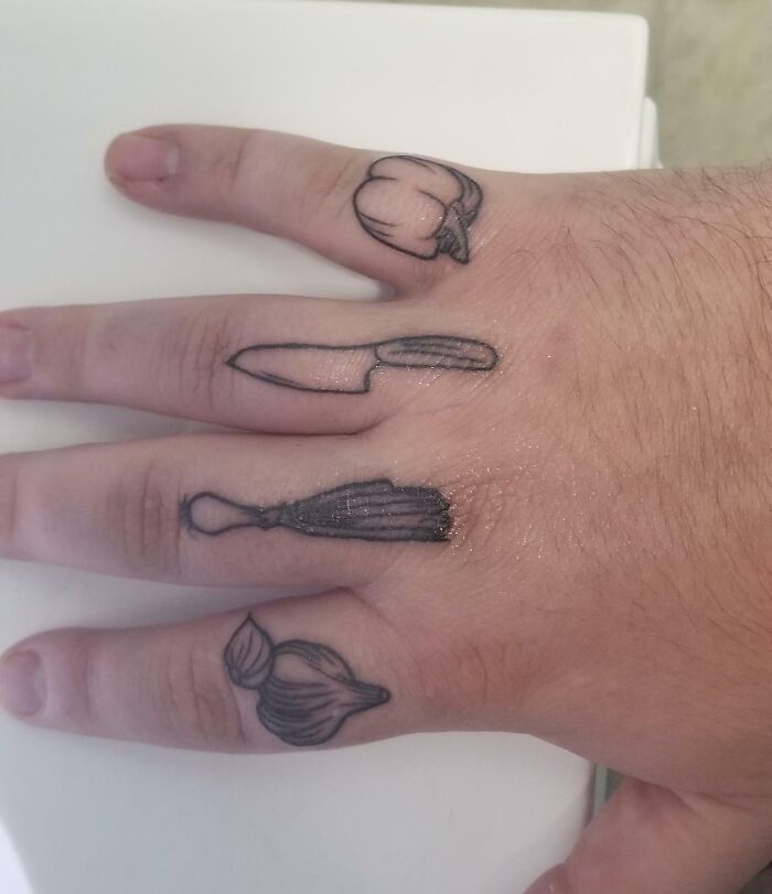 Paprika, knife, leek and garlic tattoos on each fingers