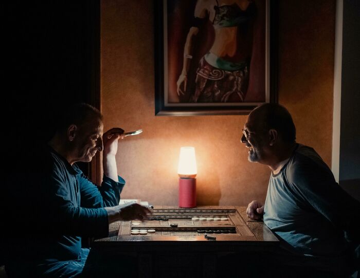 My Dad Playing Backgammon During A Blackout