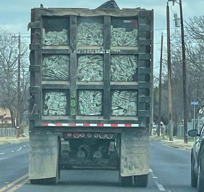 Was Driving Through Town And Ended Up Behind This Garbage Truck With A Paint Job Showing Stacks Of Money