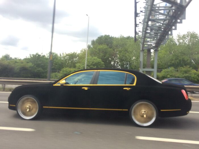 This Matte Black And Gold Car