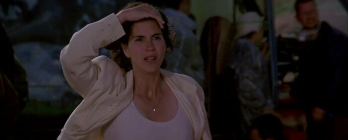 Dr. Jo Harding wearing white shirt and beige jacket 