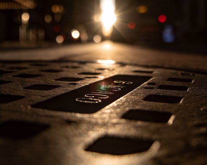 Sewer Lid And Light Shining 