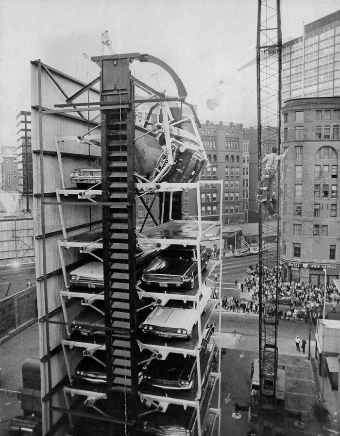 A Car Teeters At The Top Of A Paternoster Parking Elevator As A Result Of A Broken Bolt In Denver, Colorado, 1970s
