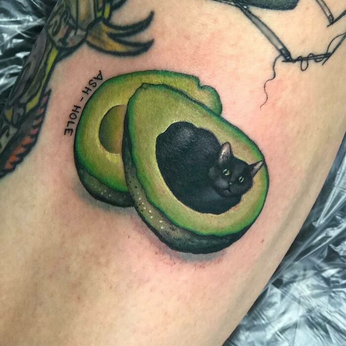 Cat inside of avocado watercolor tattoo