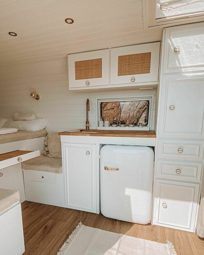White fridge and kitchen cabinets 