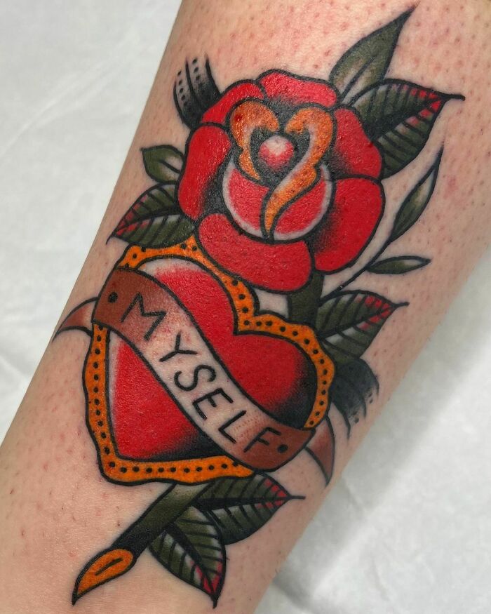 American traditional tattoo featuring a red rose and heart with a banner reading "MYSELF".