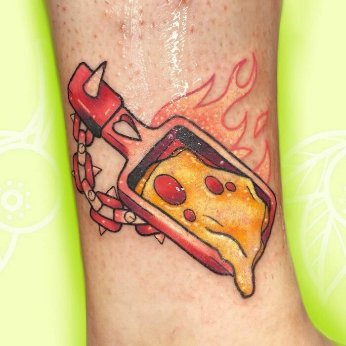 Pizza watercolor tattoo with vibrant cheese and pepperoni detail, inspired food ink art on skin.