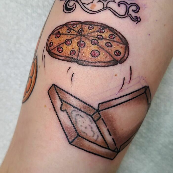 Watercolor tattoo of a pizza jumping from a box, showcasing creative food tattoo ideas.