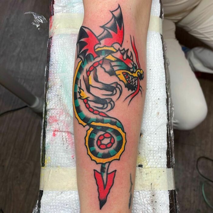 American traditional dragon arm tattoo