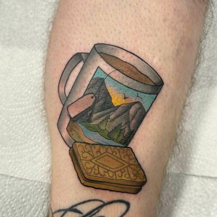Watercolor tattoo of a tea mug and cookie, offering food ink-spiration.