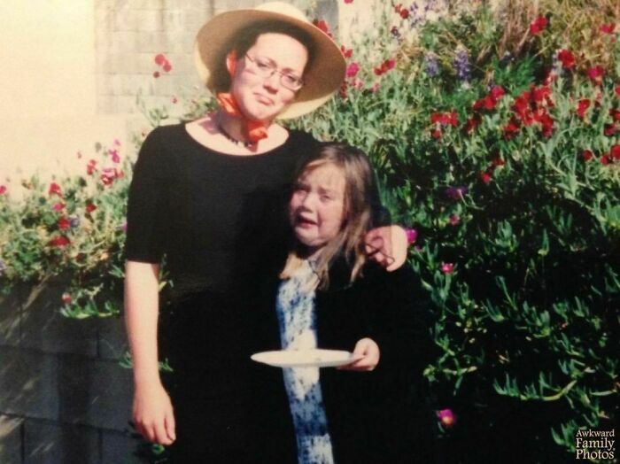 “I Was About Seven Years Old When My Favorite Betta Fish Died. I Was So Devastated That I Insisted On Hosting A Full Blown Funeral For It. We Dressed In All Black And Even Said Nice Words. My Mom Took This Photo In Our Back Yard Before We Buried It. My Older Sister Is Trying Her Hardest Not To Laugh While I Stood There Holding My Dead Fish On A Paper Plate."⁠