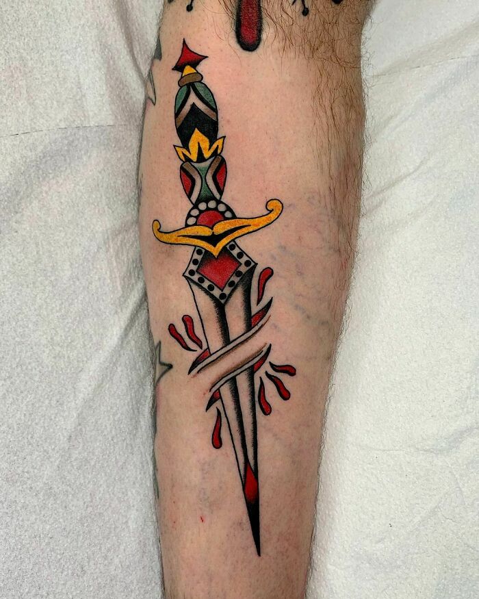 American traditional dagger arm tattoo