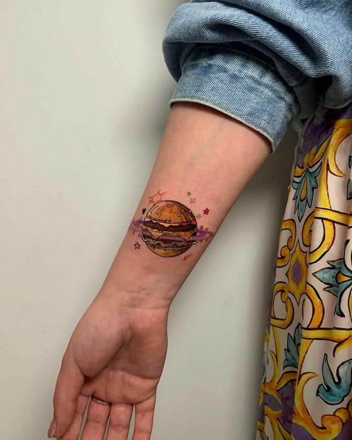 Burger planet watercolor wirst tattoo