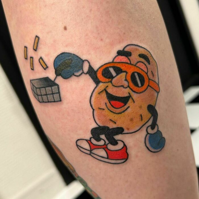 Watercolor tattoo of a cheerful potato chef, featuring food inspiration.
