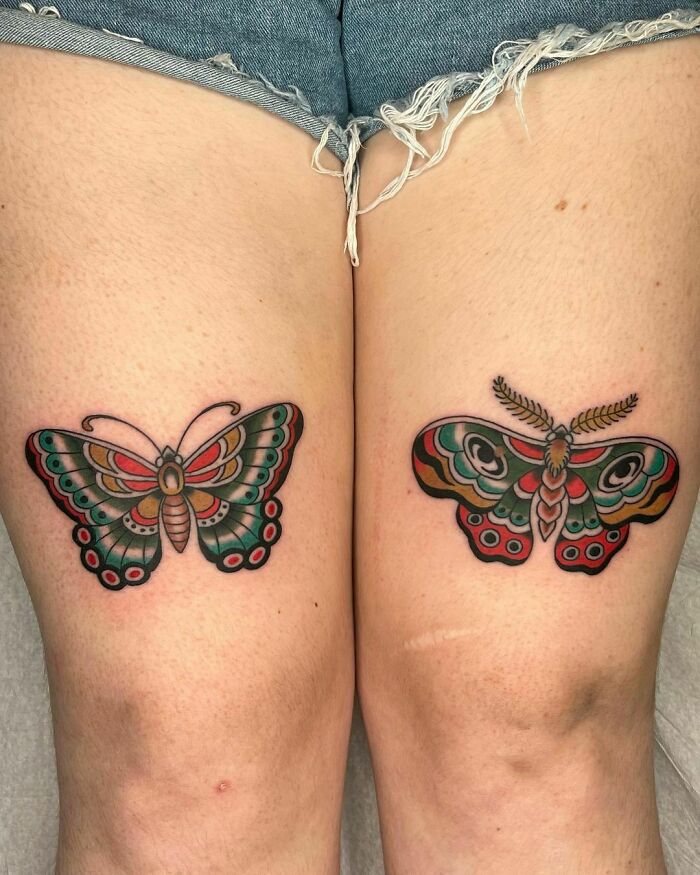 Colorful American traditional tattoos featuring butterflies on thighs.