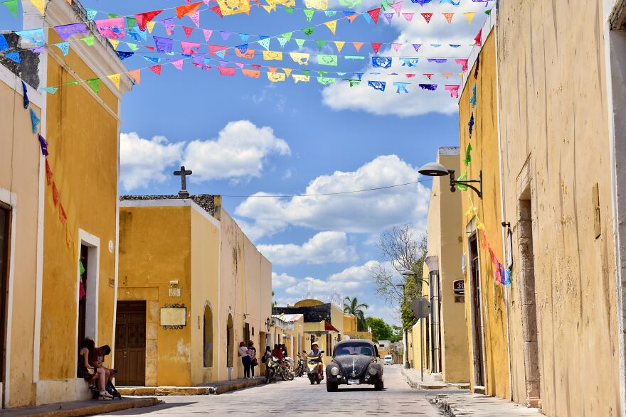 A Cute Street With Papel Picado In Izamal, Yucatan, Mexico