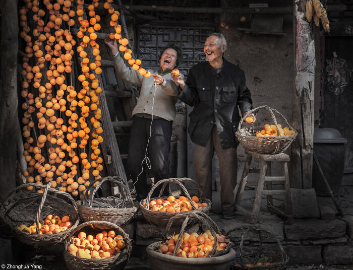 1st Place, Pink Lady® Moments Of Joy: Hanging Up Persimmons By Zhonghua Yang (China)