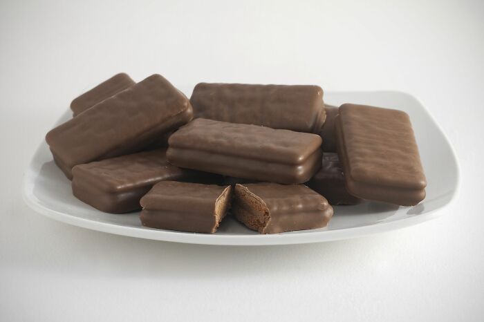 Multiple Tim Tams in a white plate 