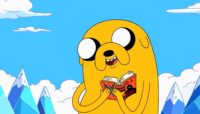 Jake the Dog holding a book
