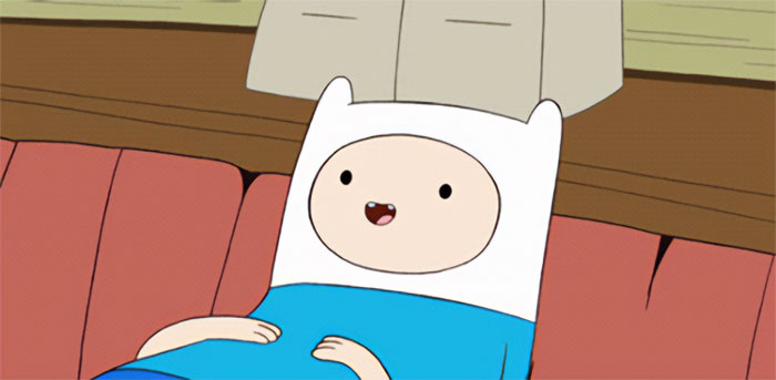 Finn the Human lying and smilling on the bed